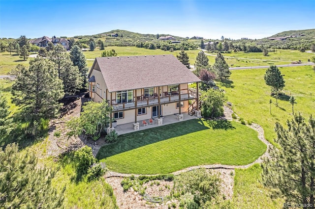 drone / aerial view featuring a mountain view