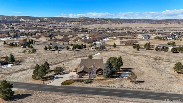 drone / aerial view featuring a mountain view