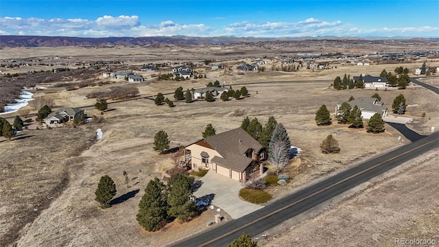 bird's eye view featuring a mountain view and view of desert