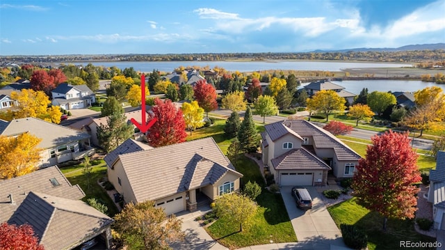 aerial view with a residential view and a water view