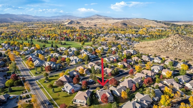 aerial view with a mountain view and a residential view