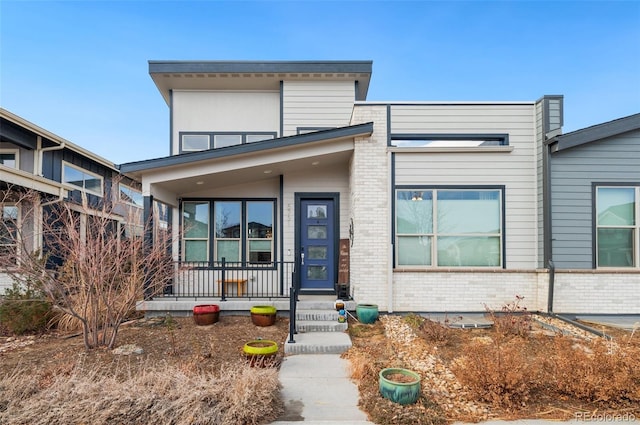 contemporary house with a porch