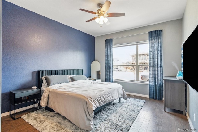 bedroom with ceiling fan and hardwood / wood-style floors