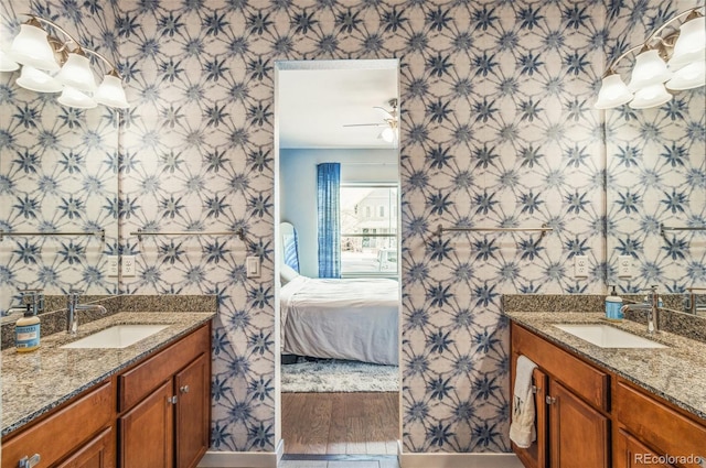 bathroom with hardwood / wood-style flooring and vanity