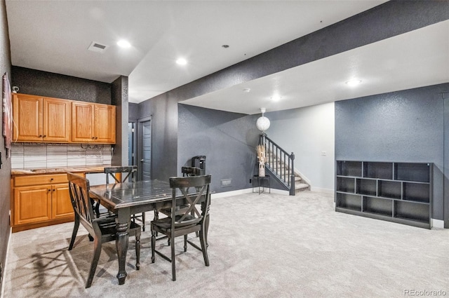 view of carpeted dining area