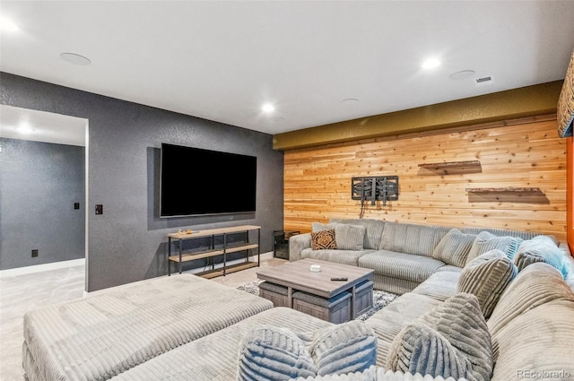 living room featuring wood walls