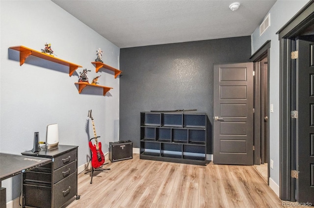 miscellaneous room with light hardwood / wood-style flooring