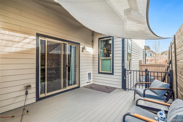 wooden deck featuring central air condition unit