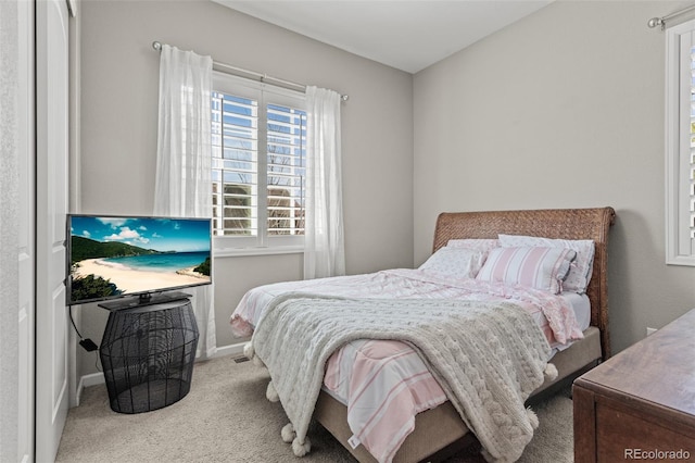 bedroom featuring light carpet