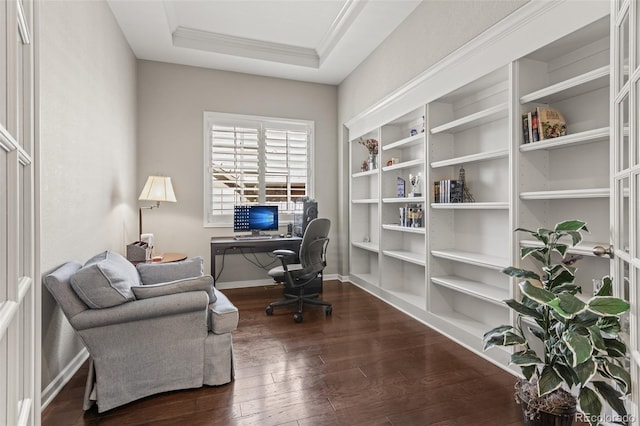 office with a tray ceiling, ornamental molding, and dark hardwood / wood-style floors