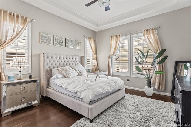 bedroom featuring ceiling fan, dark wood-type flooring, and crown molding