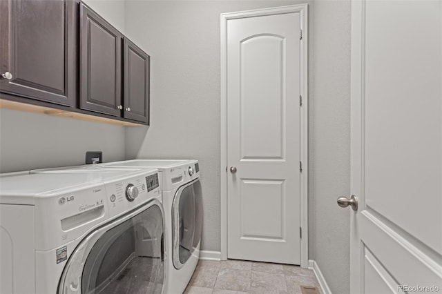 washroom with cabinets and separate washer and dryer