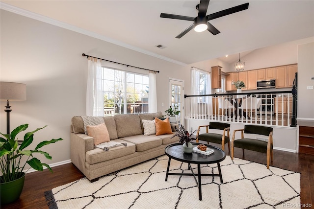 living room featuring lofted ceiling, hardwood / wood-style flooring, ceiling fan, and ornamental molding