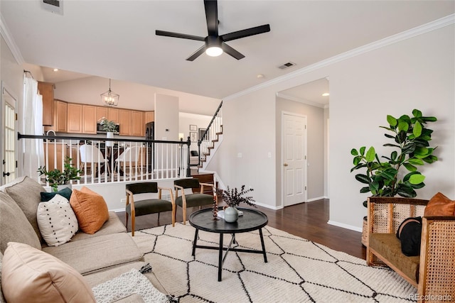 living room with ceiling fan, hardwood / wood-style floors, and crown molding