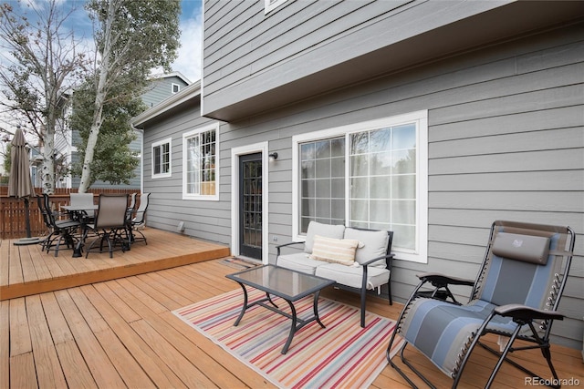 wooden deck featuring an outdoor living space