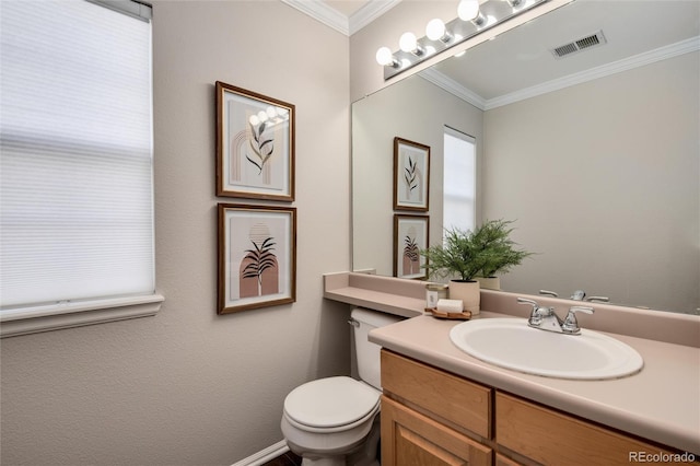 bathroom featuring toilet, ornamental molding, and vanity