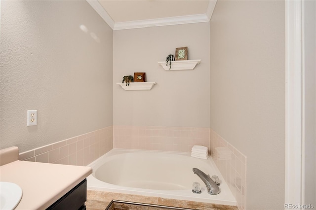 bathroom featuring ornamental molding, vanity, and a relaxing tiled tub