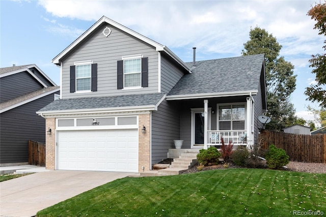 front facade featuring a front yard, a garage, and a porch