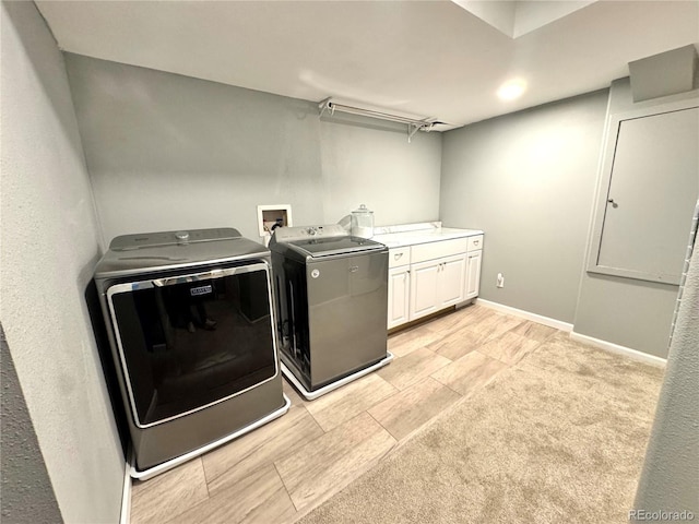 laundry area with cabinet space and washer and clothes dryer
