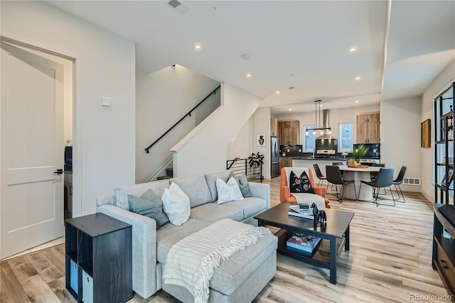 living room with light hardwood / wood-style floors