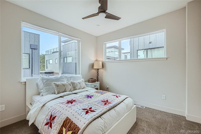 carpeted bedroom with ceiling fan