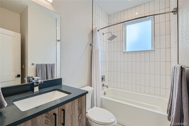 full bathroom featuring toilet, vanity, and tiled shower / bath combo