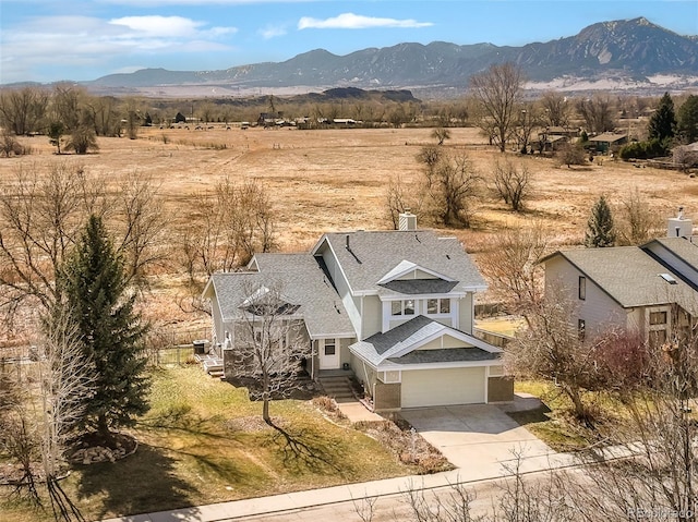 bird's eye view featuring a mountain view and a rural view