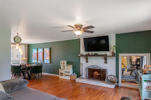 1521 Columbine Blvd, Colorado Springs, CO 80907 - living room featuring wood finished floors, a fireplace, and a ceiling fan