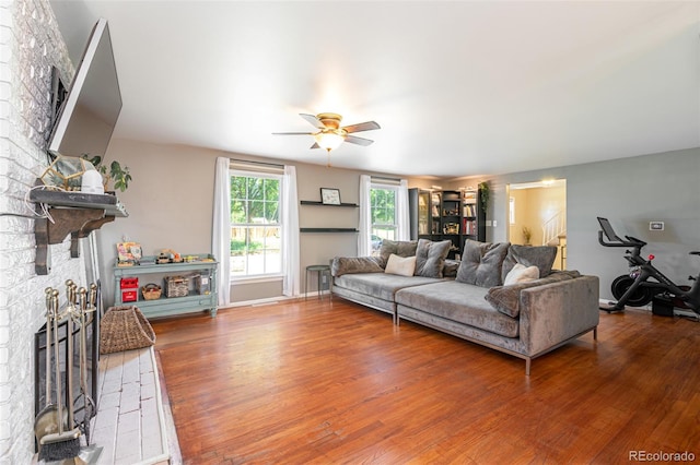 1521 Columbine Blvd, Colorado Springs, CO 80907 - living area featuring a ceiling fan, wood finished floors, and a stone fireplace