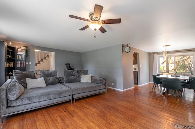 1521 Columbine Blvd, Colorado Springs, CO 80907 - living room featuring stairs, wood finished floors, and a ceiling fan