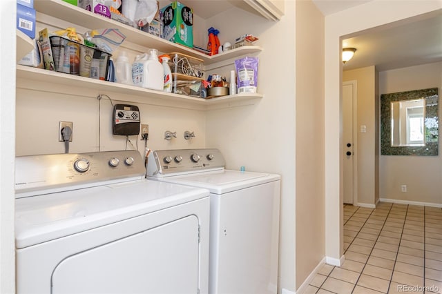 1521 Columbine Blvd, Colorado Springs, CO 80907 - washroom with light tile patterned floors and washer and clothes dryer
