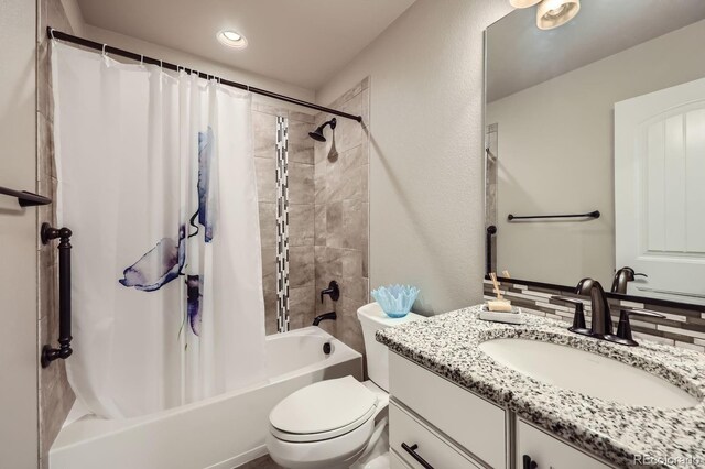 full bathroom featuring shower / bath combo, toilet, vanity, and recessed lighting