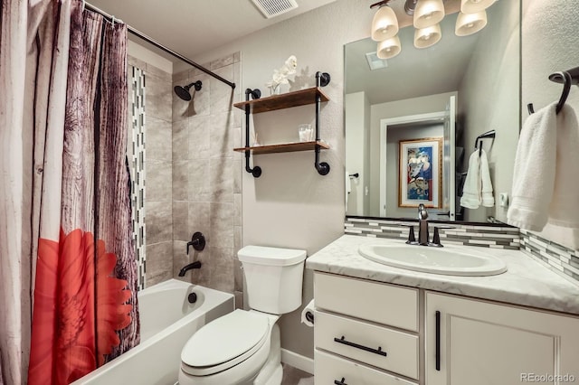 full bathroom featuring shower / bath combination with curtain, visible vents, vanity, and toilet