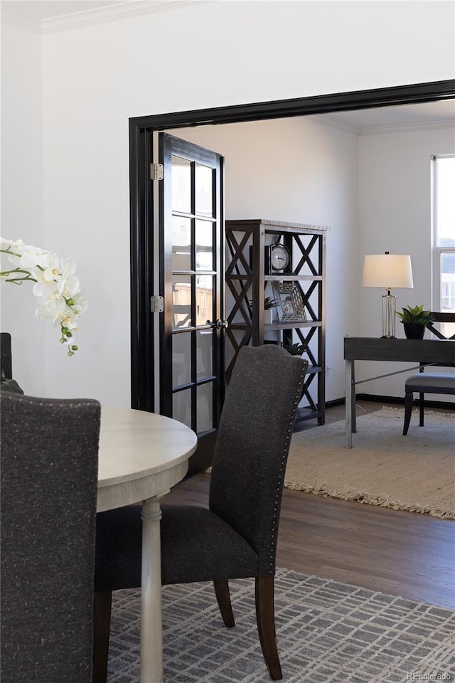 interior space featuring hardwood / wood-style floors and crown molding