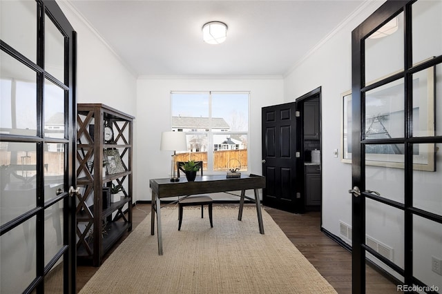 home office featuring ornamental molding and dark wood-type flooring