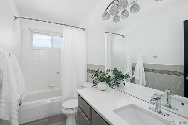 full bathroom featuring vanity, wood-type flooring, toilet, and shower / bath combo