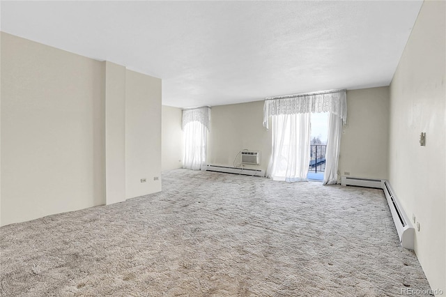 carpeted empty room featuring baseboard heating