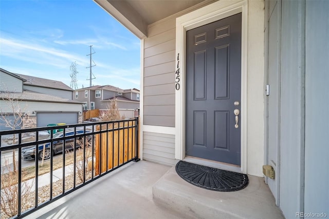 property entrance with a balcony