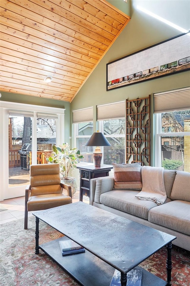 tiled living room featuring wood ceiling and high vaulted ceiling