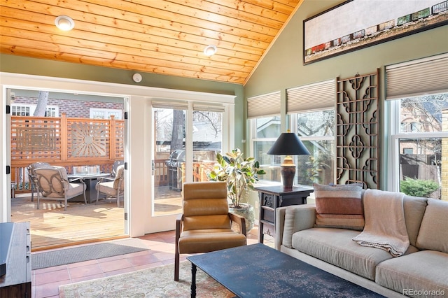 living area with tile patterned flooring, wooden ceiling, and vaulted ceiling