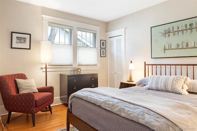 bedroom with a closet and wood finished floors