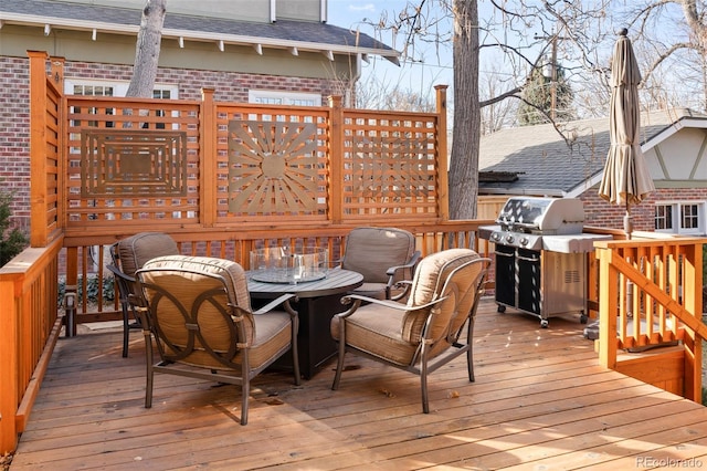 wooden terrace featuring outdoor dining area and area for grilling