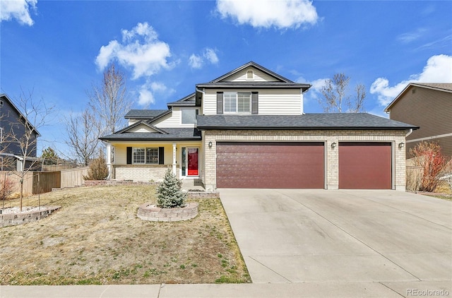 traditional-style home featuring driveway, a shingled roof, fence, and brick siding