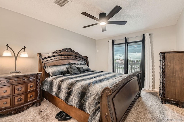8100 W Quincy Ave Unit 11, Denver, CO 80123 - carpeted bedroom with a textured ceiling, access to outside, and a ceiling fan