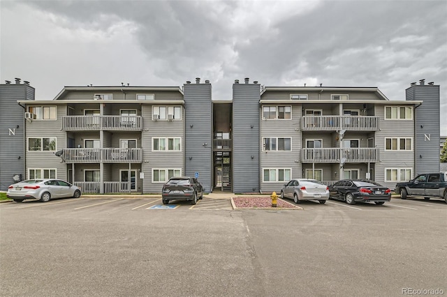 8100 W Quincy Ave Unit 11, Denver, CO 80123 - view of apartment building / complex with uncovered parking