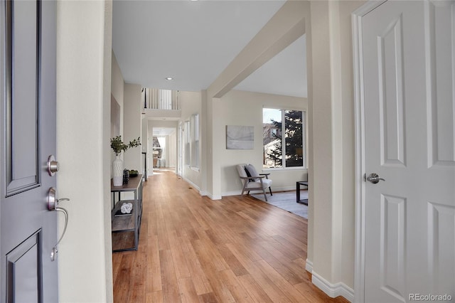 foyer entrance with light hardwood / wood-style floors