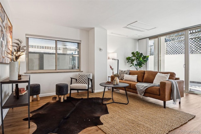 interior space featuring hardwood / wood-style flooring and a wall of windows