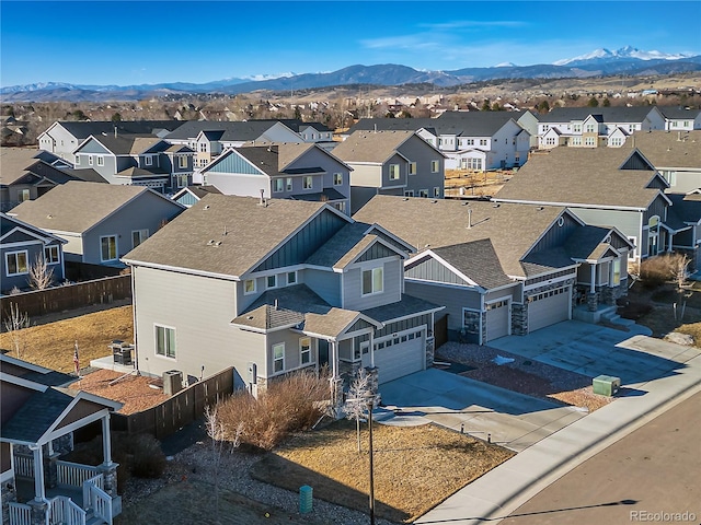 drone / aerial view with a mountain view and a residential view