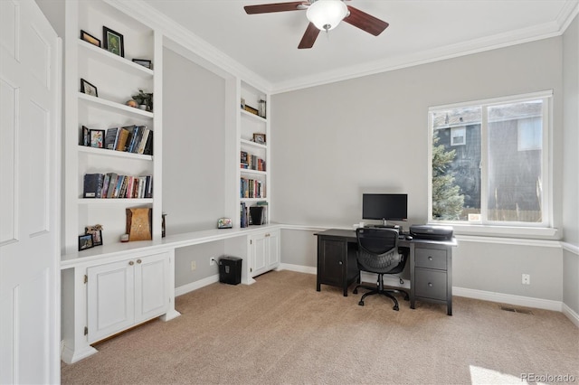 office area with light carpet and ornamental molding