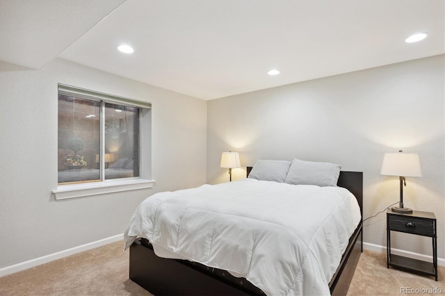 bedroom featuring light colored carpet